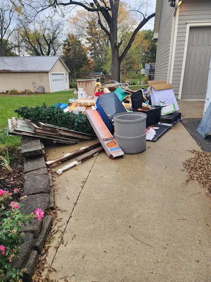 Dumpster being loaded with debris for Residential Dumpster Rental in Bridgeville